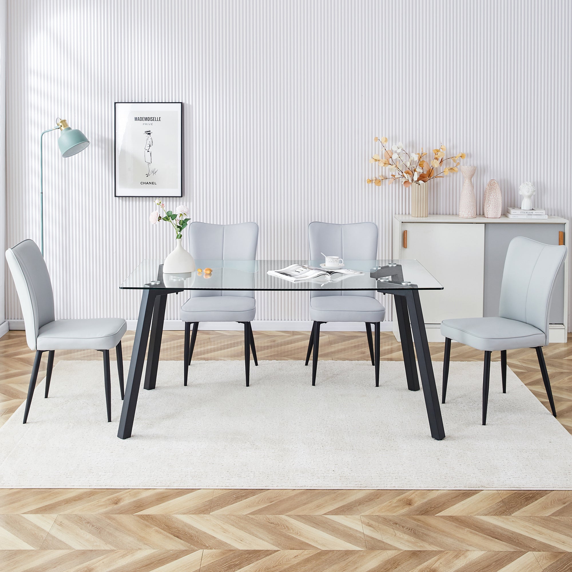 Table and chair set. 1 table and 6 light grey chairs. Glass dining table with 0.31-inch tempered glass tabletop and black coated metal legs. Equipped with light grey PU chairs 1123 008