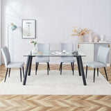 1 table and 6 light grey chairs. Glass dining table with black coated metal legs