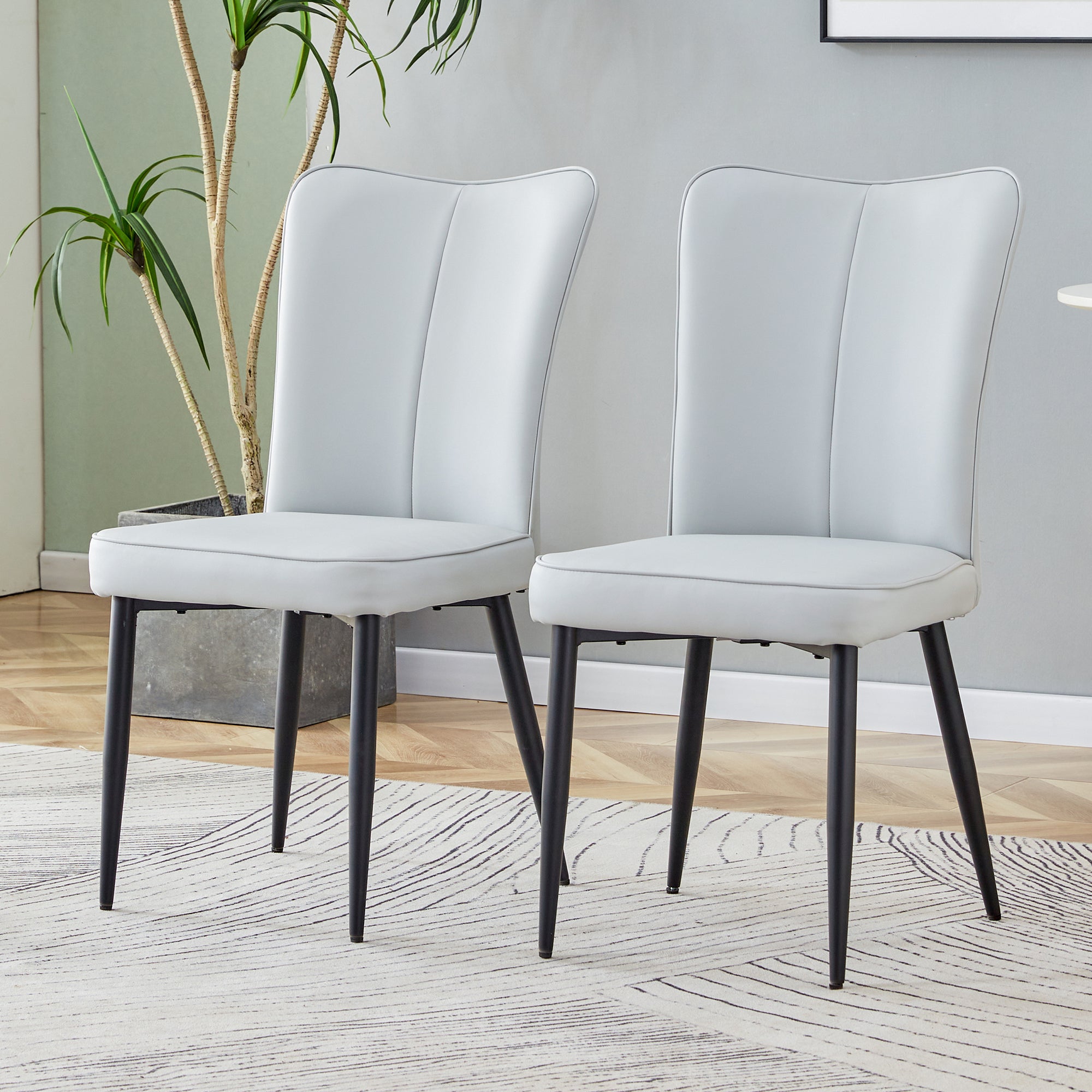 Table and chair set. 1 table and 6 light grey chairs. Glass dining table with 0.31-inch tempered glass tabletop and black coated metal legs. Equipped with light grey PU chairs 1123 008