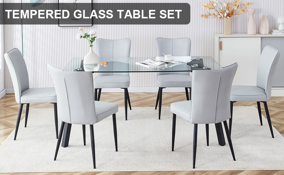 Table and chair set. 1 table and 6 light grey chairs. Glass dining table with 0.31-inch tempered glass tabletop and black coated metal legs. Equipped with light grey PU chairs 1123 008