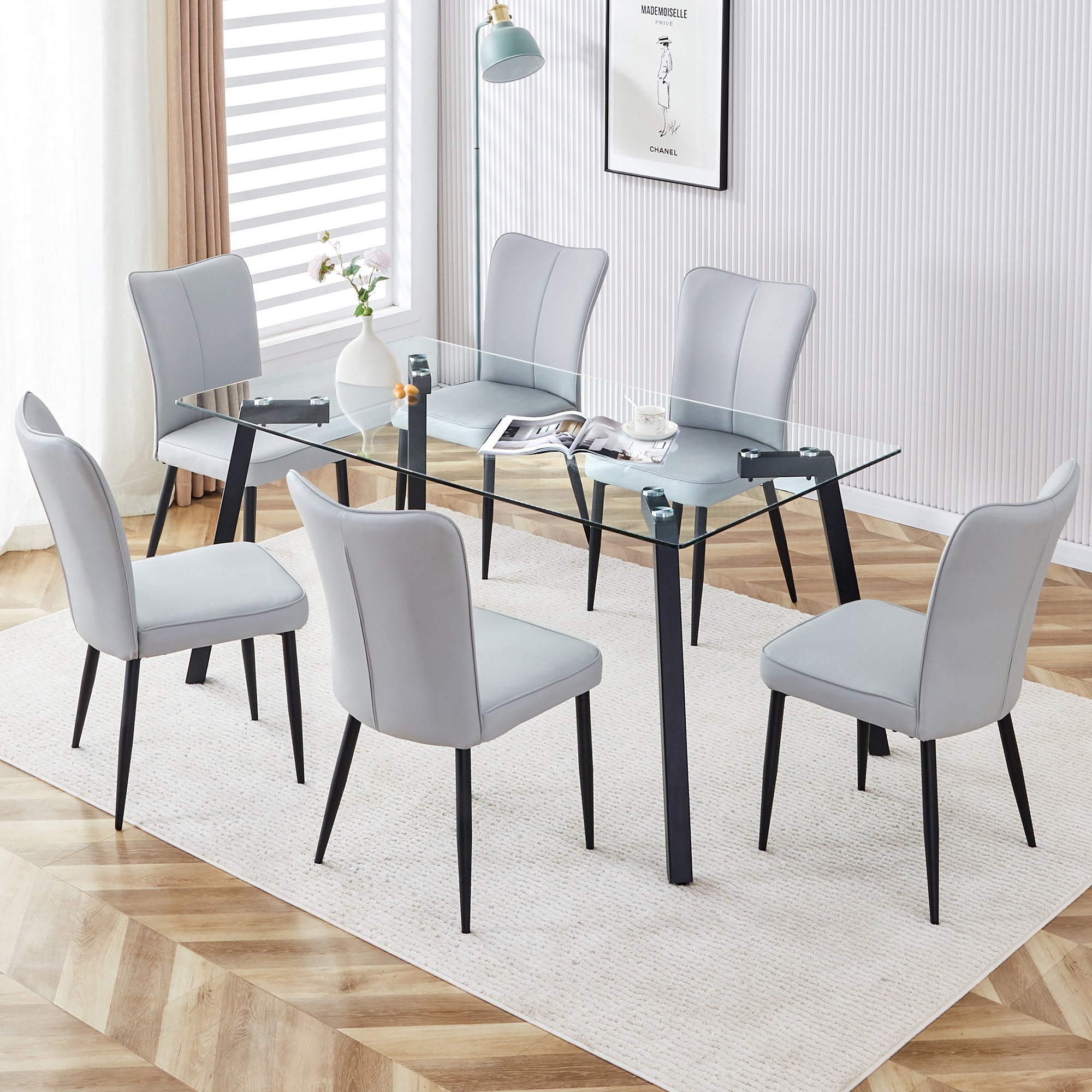 Table and chair set. 1 table and 6 light grey chairs. Glass dining table with 0.31-inch tempered glass tabletop and black coated metal legs. Equipped with light grey PU chairs 1123 008