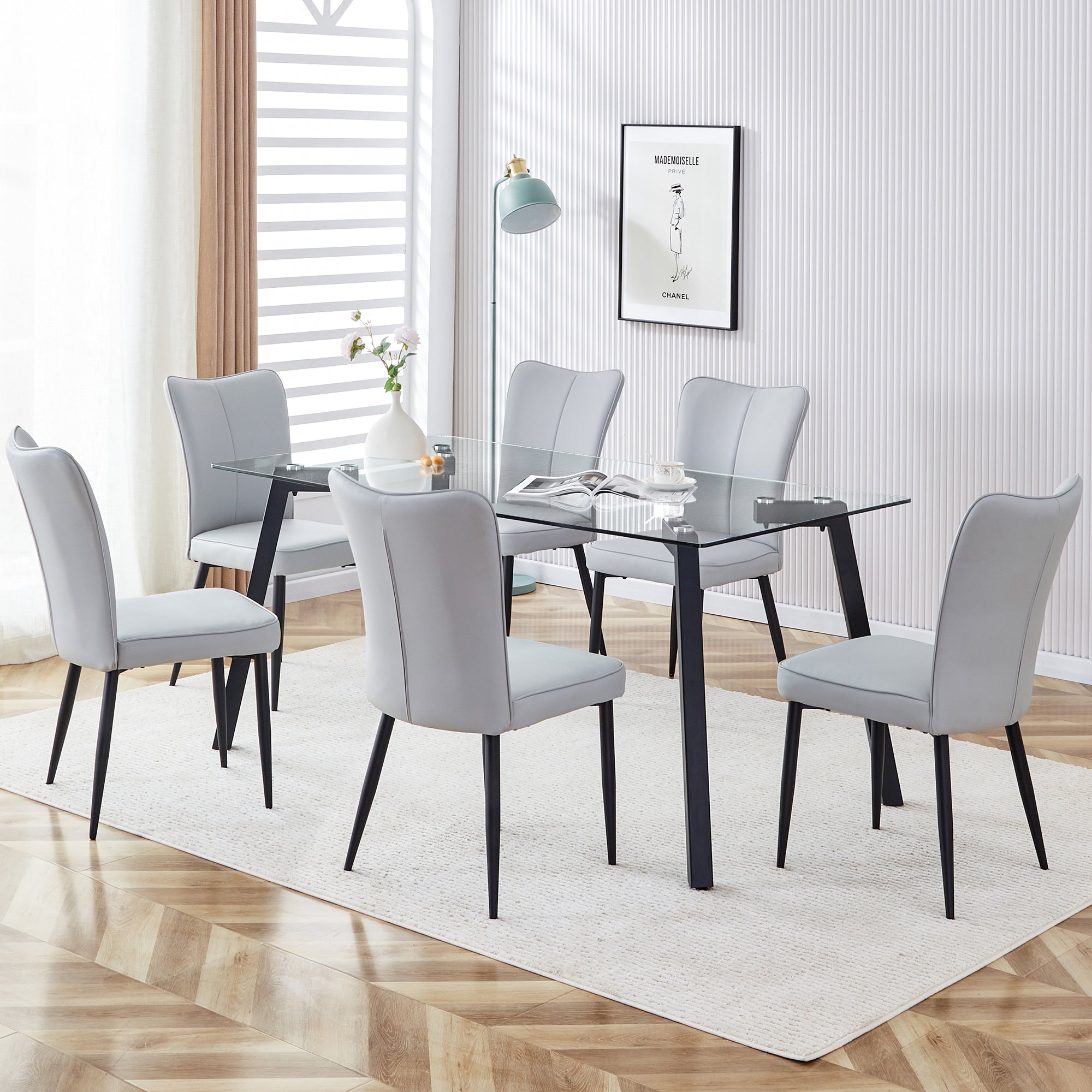 Table and chair set. 1 table and 6 light grey chairs. Glass dining table with 0.31-inch tempered glass tabletop and black coated metal legs. Equipped with light grey PU chairs 1123 008